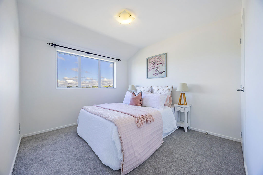 Cosy bedroom at 9/11 Hatfield Place, Albany Heights dream home with sunlit outlook and neutral tones, offering flexibility for home office or nursery use.