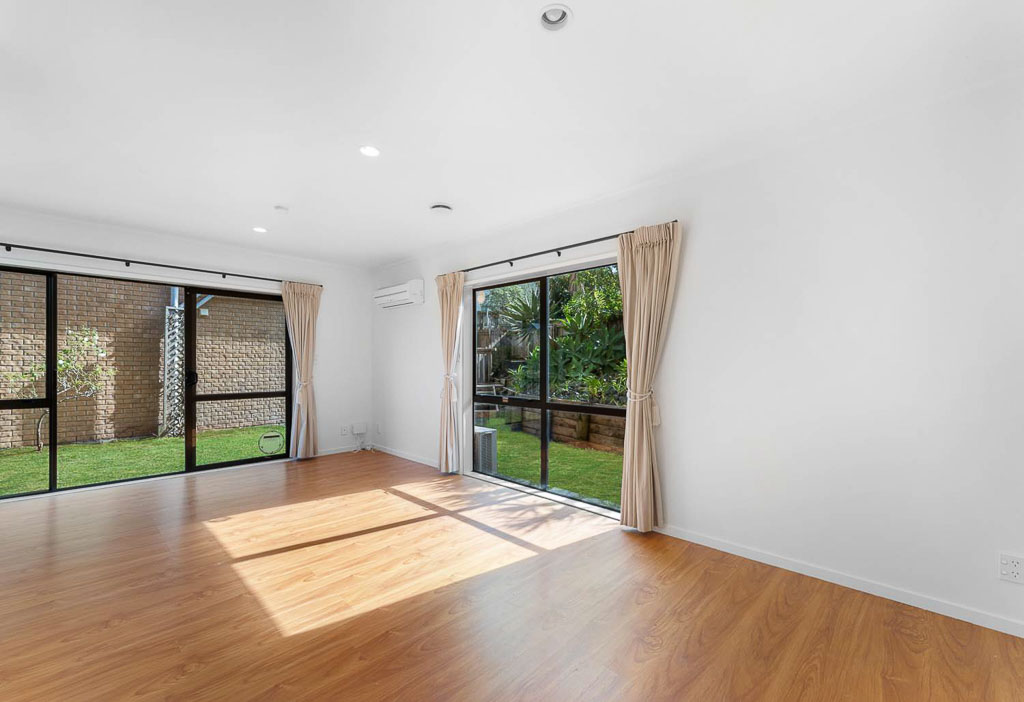 North-facing living room in affordable home for sale in Albany, offering sliding doors to private garden and fantastic indoor-outdoor flow.