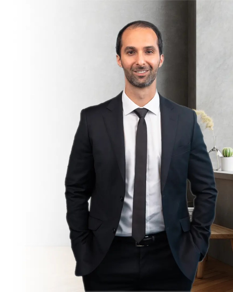 Michael Hossaini professional portrait with text stating your Auckland Real Estate Agent.
